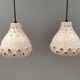Two ceramic hanging lamps, in creamy white color, looking almost like coral