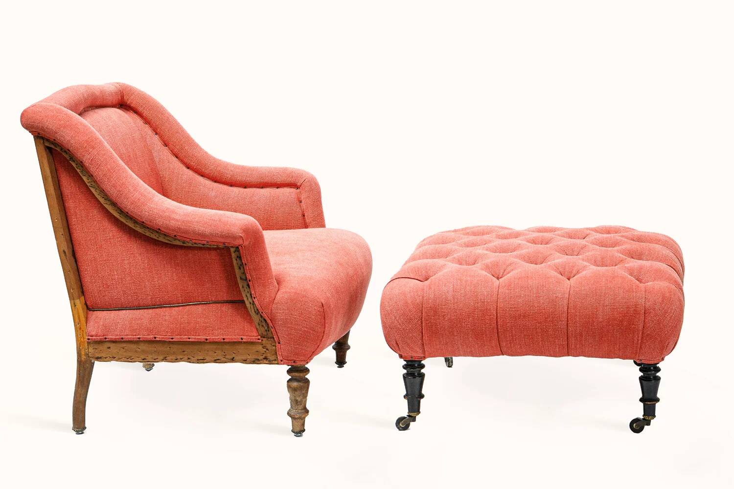 Napoleon III salon armchair in brick red linen with a tufted footrest.