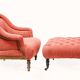 Napoleon III salon armchair in brick red linen with a tufted footrest.