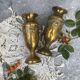 Pair of embossed brass bud vases stamped 17 cm