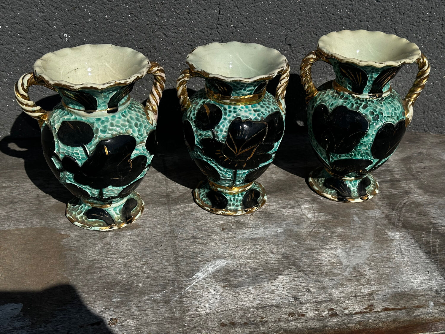 Trio of Vallauris vases in turquoise and black, highlighted with gold, 22 cm high