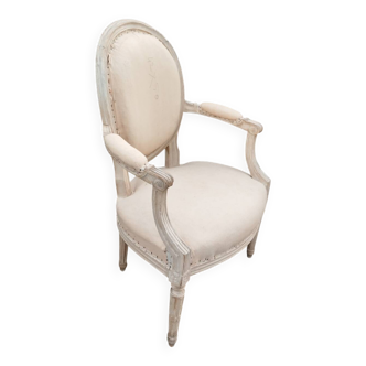 Antique armchair in Louis XVI style from the late 19th century.
