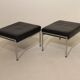 Pair of designer leather and brushed stainless steel footrests - Rob Parry