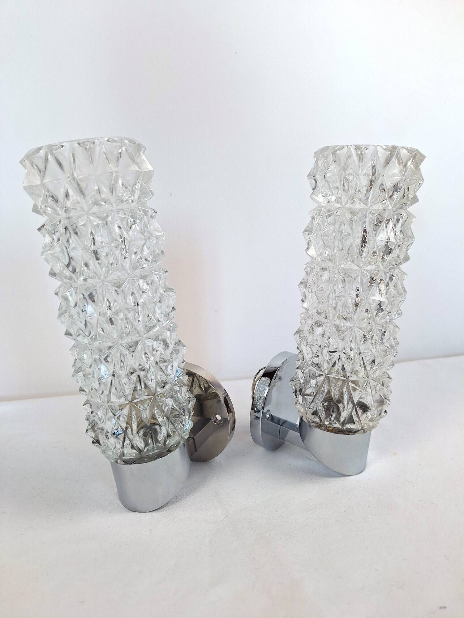 Pair of vintage Art Deco space age chrome and molded glass wall sconces