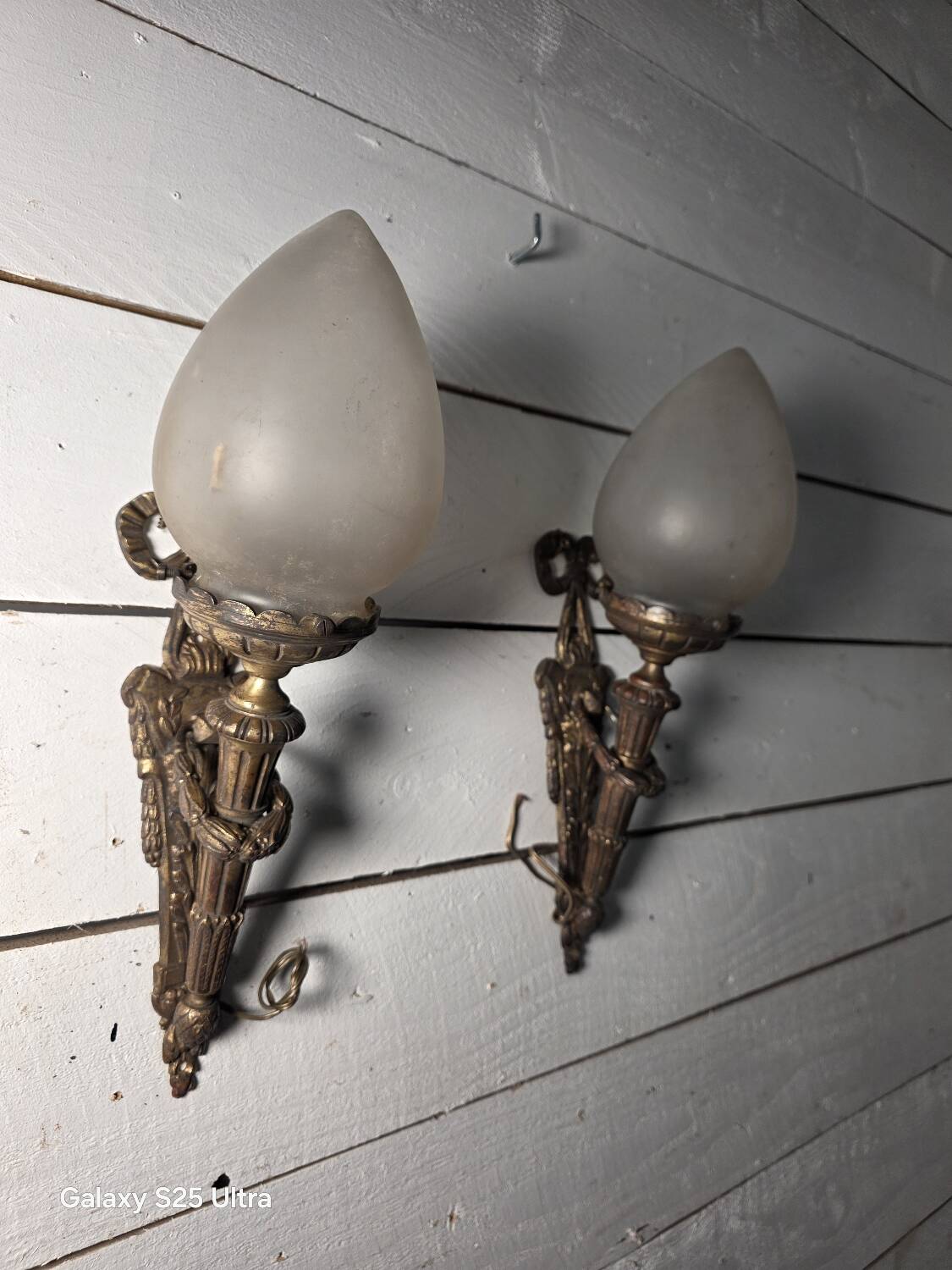 Pair of torch wall lights in Louis XVI style in 19th-century bronze.