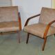 Pair of Cesky Nabytek armchairs from the 1950s in brown leather with a wooden structure in Mid-Century style.