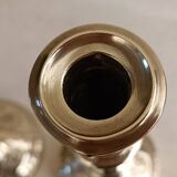 Pair of chiseled brass candlesticks