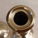 Pair of chiseled brass candlesticks