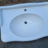 White ceramic wall washbasin with 2 ceramic legs