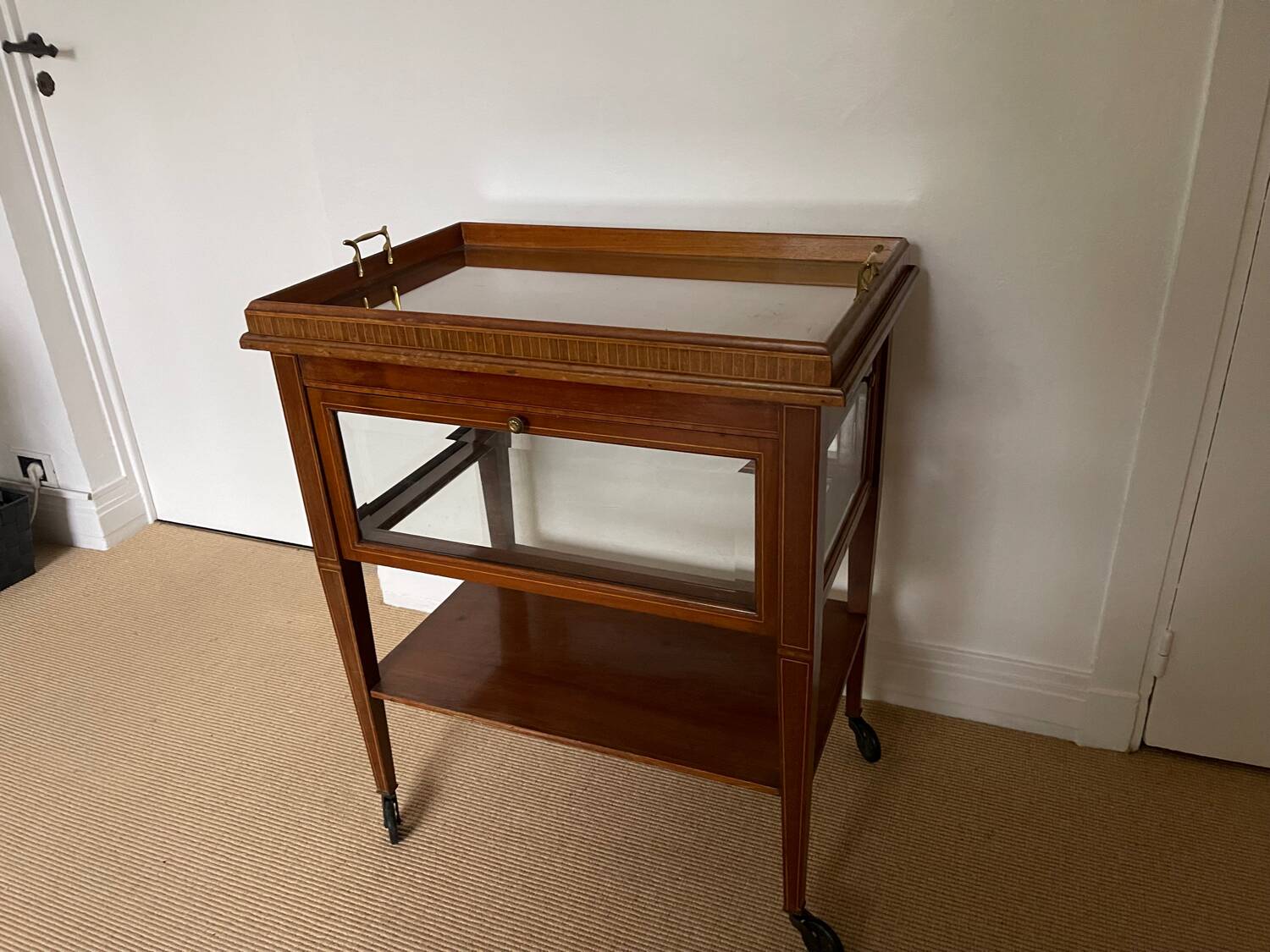 Serving Light mahogany English tea table. Beveled windows. circa 1900. Removable glass top.