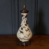 Porcelain lamp in the Indochinese style enhanced with gilding