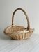 Large antique woven wicker basket with handle.