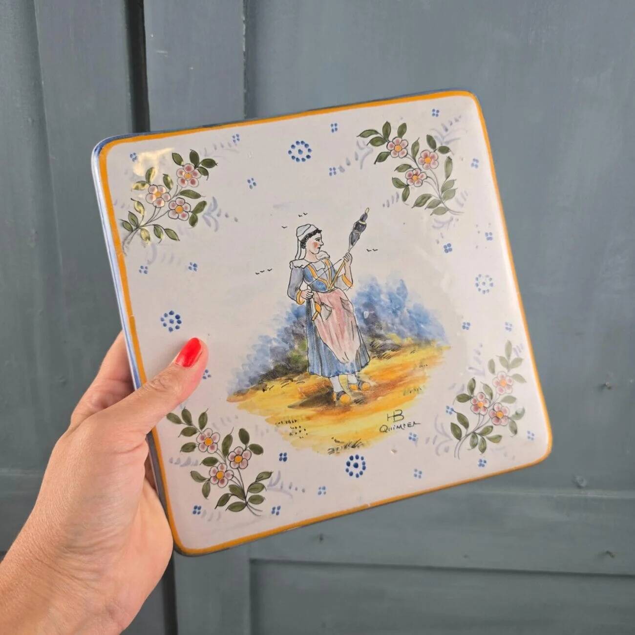 Old HB Quimper trivet – Breton woman with a distaff