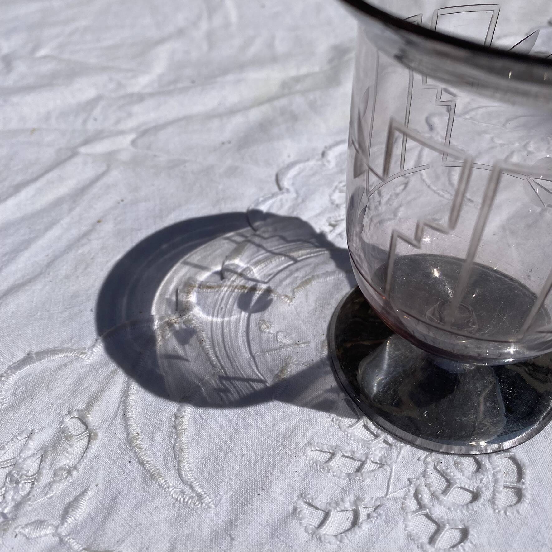 Antique Art Deco engraved glass, silvered rim and base.