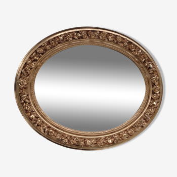 Golden oval mirror