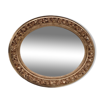 Golden oval mirror