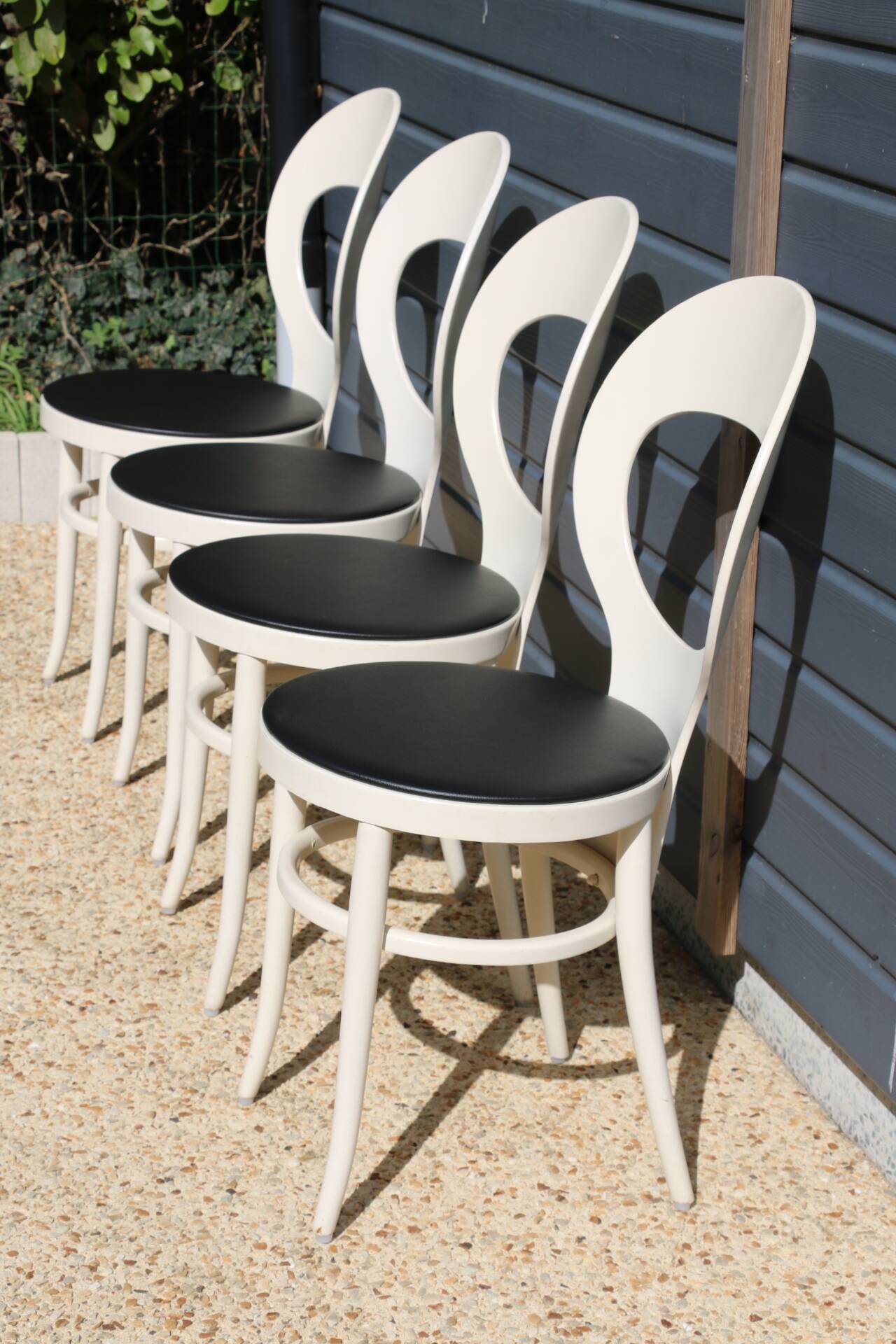 6 baumann chairs, white gull with black faux leather.