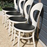 6 baumann chairs, white gull with black faux leather.