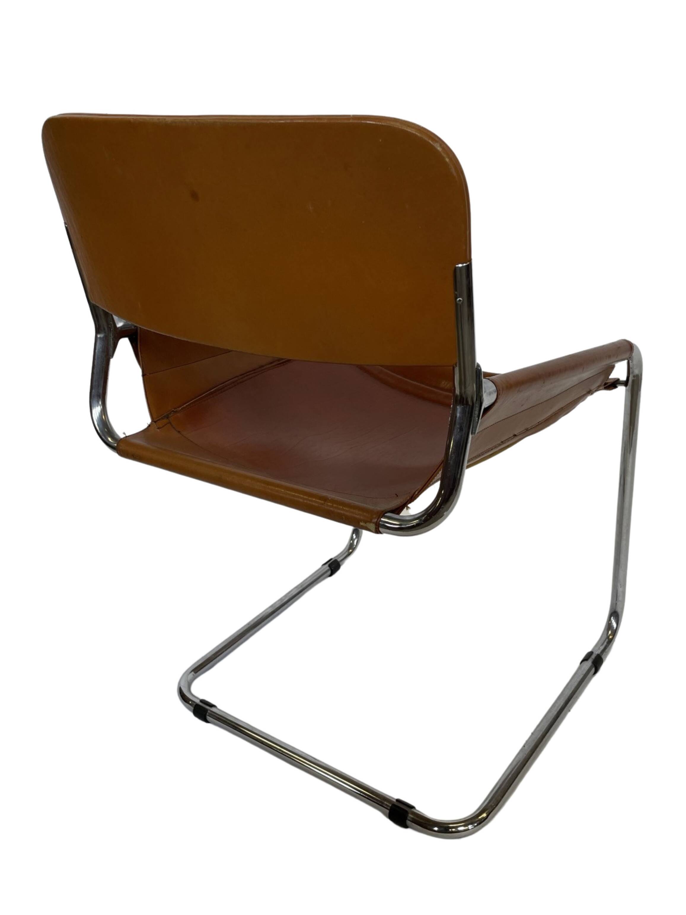 vintage dining room chair in cognac leather and chrome 1970s Italy