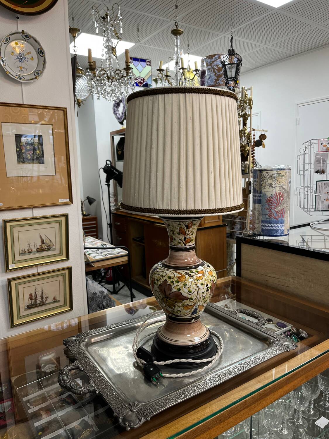 A pair of lamps with a pleated couture lampshade in wild silk