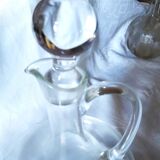 Mouth-blown crystal ewer-shaped carafe with handmade decoration and stopper