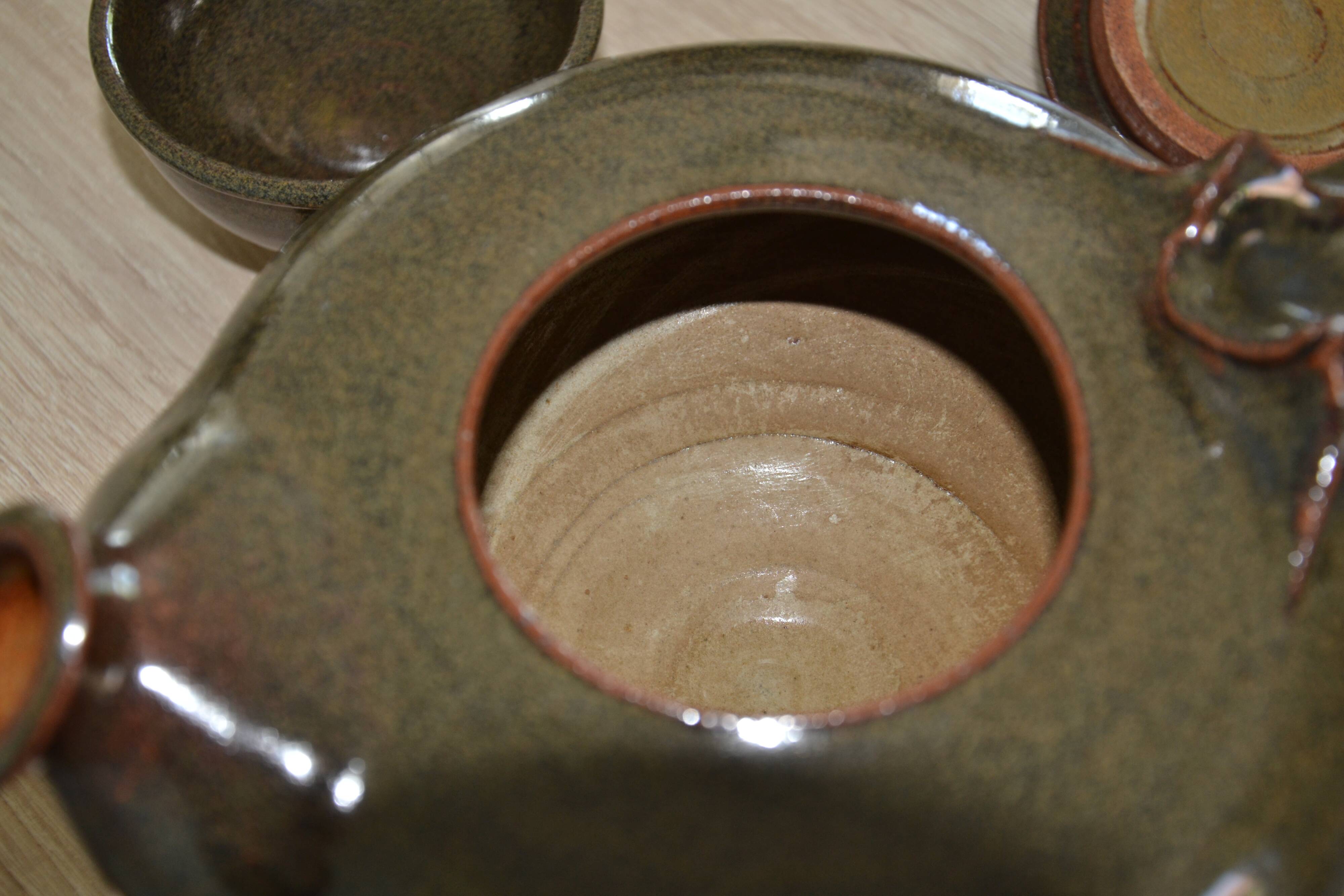 Antique stoneware teapot and its six signed bowls