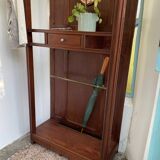 Antique wooden coat rack with mirror and shelf.