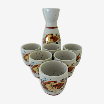 Far Eastern porcelain sake service consisting of a carafon and six cups