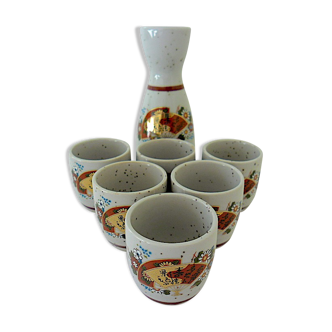 Far Eastern porcelain sake service consisting of a carafon and six cups