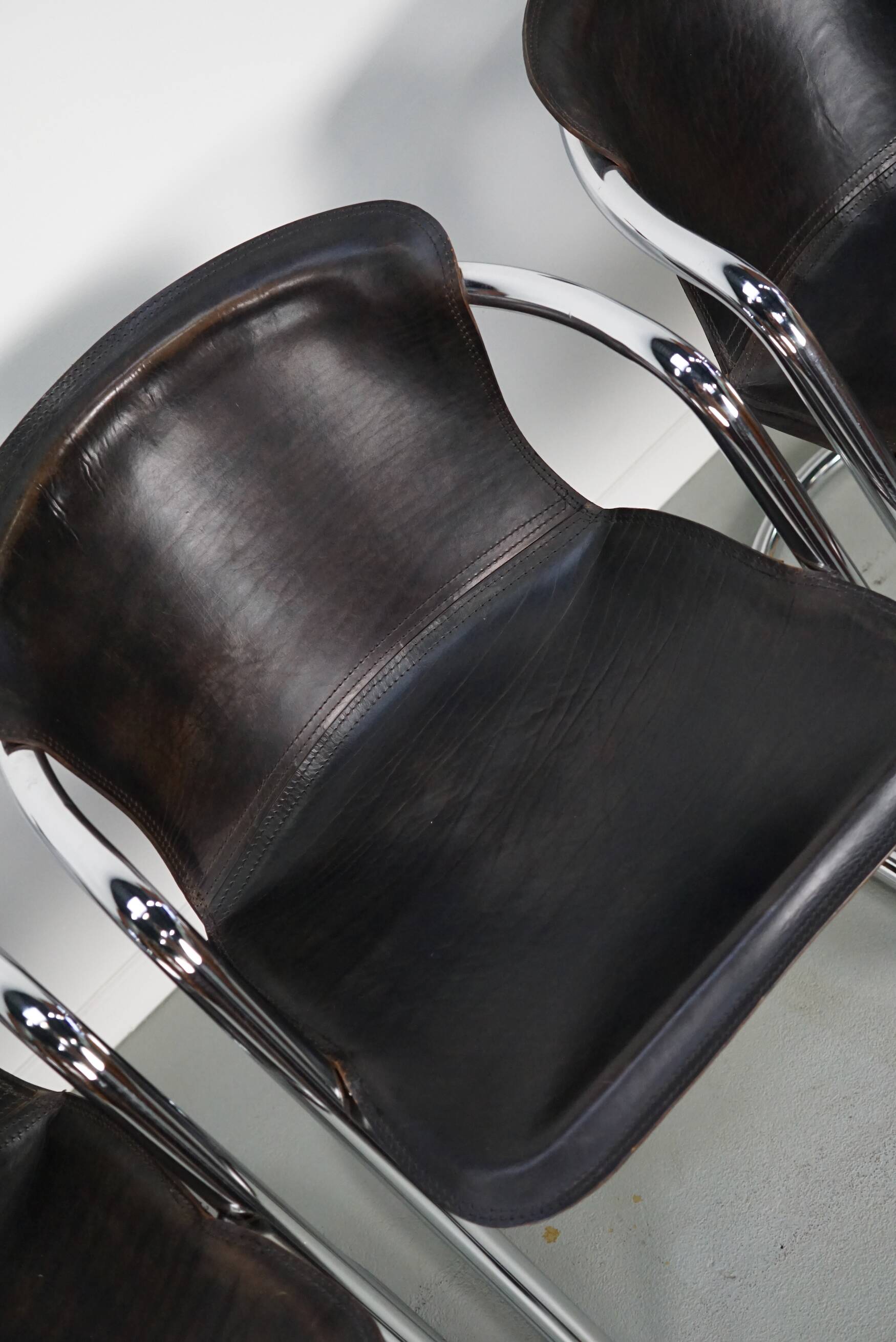 Set of four brown leather dining chairs, Willy Rizzo, 1970