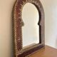 Miroir vintage en cuir clouté et laiton