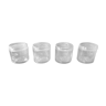 Series of 4 white glass jars