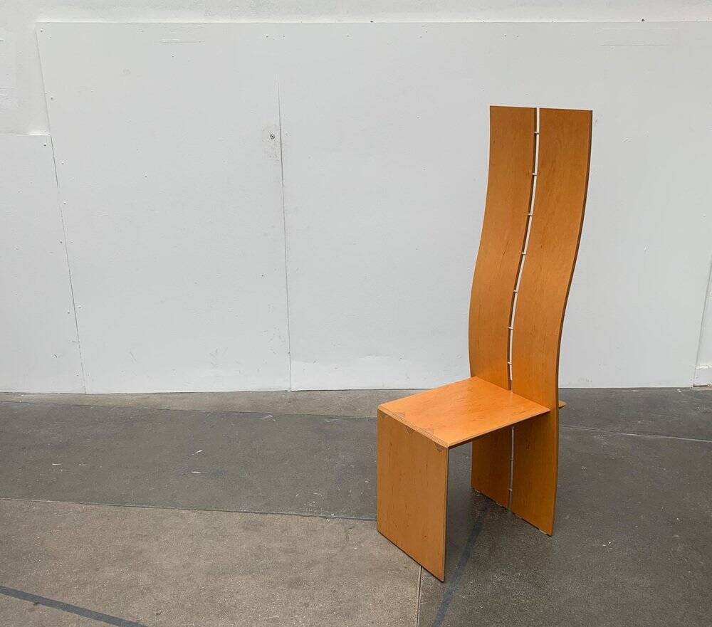 Postmodern chair with a high backrest