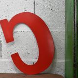 Industrial letter "C" in red metal