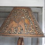 Liane and metal floor lamp with perforated leather shade featuring elephant patterns, lise.