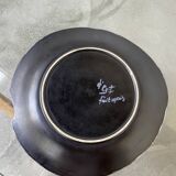 Black ceramic plate from the 60s