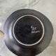 Black ceramic plate from the 60s