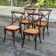 4 bistro chairs with curved wooden backs and cross braces / Crossback