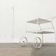 Mid-century modern minimalist perforated metal bar cart from the 1960s.