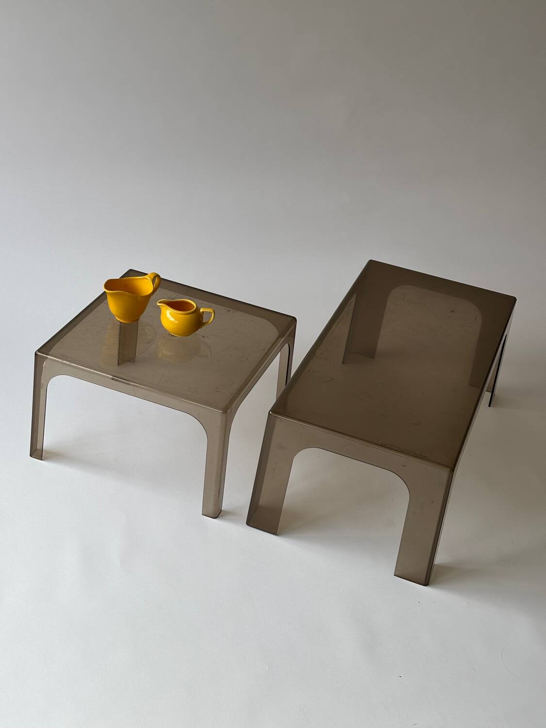 Smoked plastic coffee tables 1970