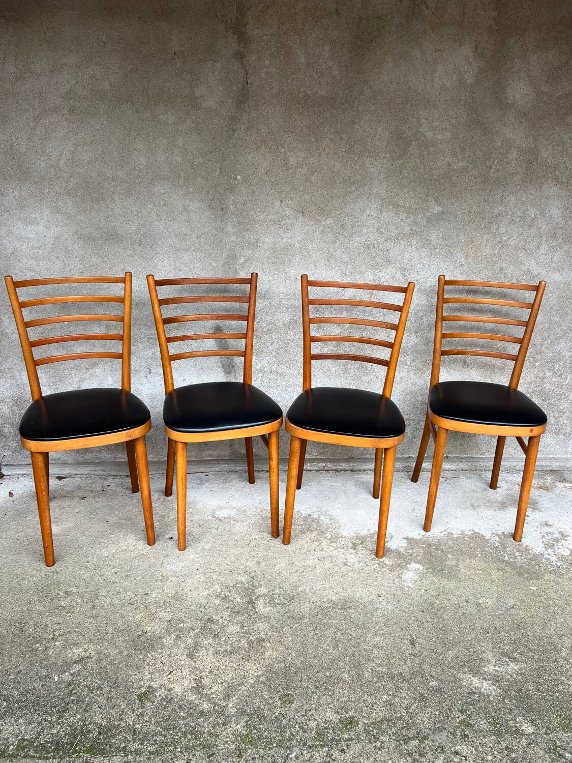 Set of 4 vintage wooden chairs with faux leather.