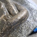 Bas-relief plaque of a rabbit in brown patina, seated cat