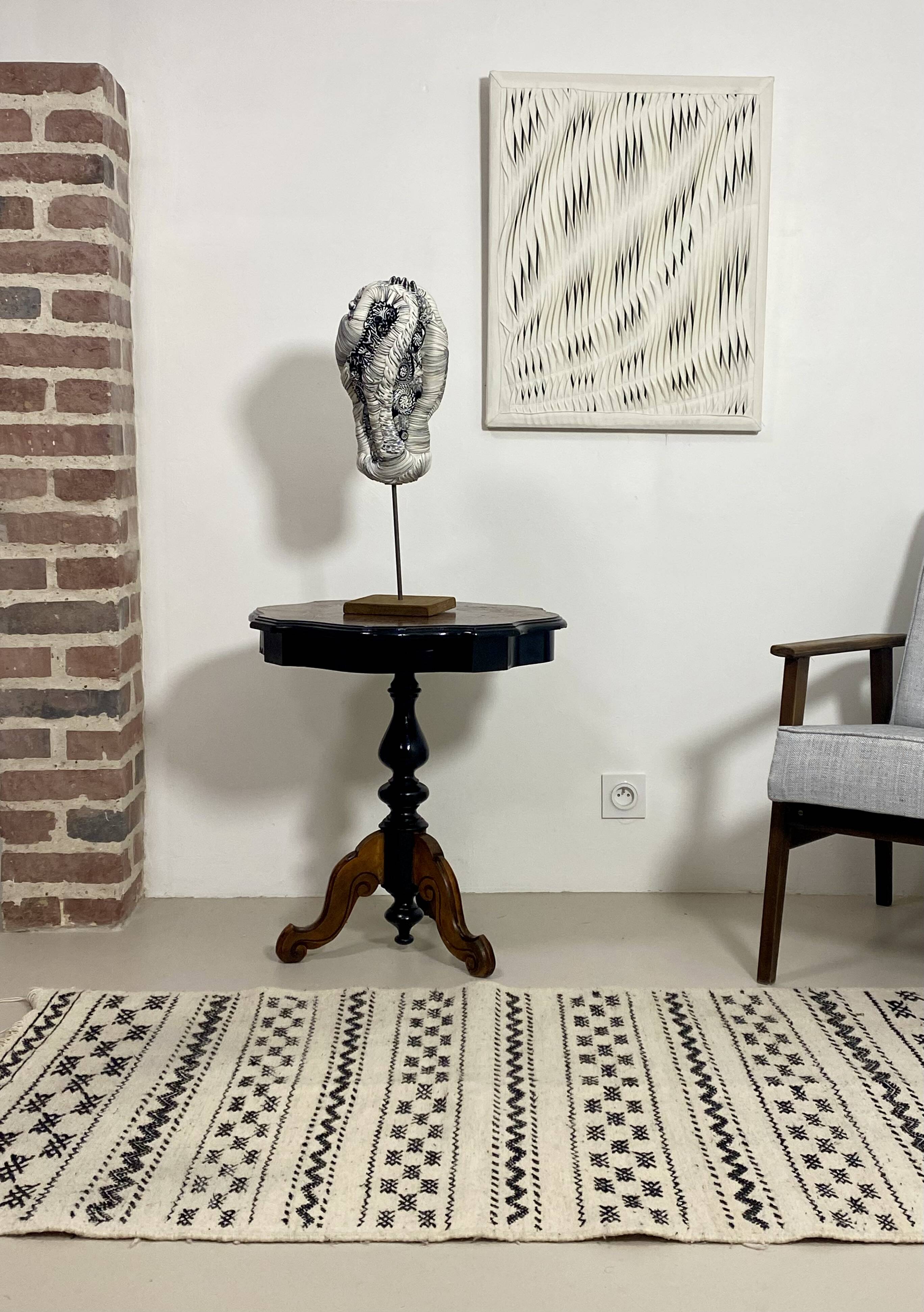 Two-tone black and mahogany pedestal table with mahogany veneer