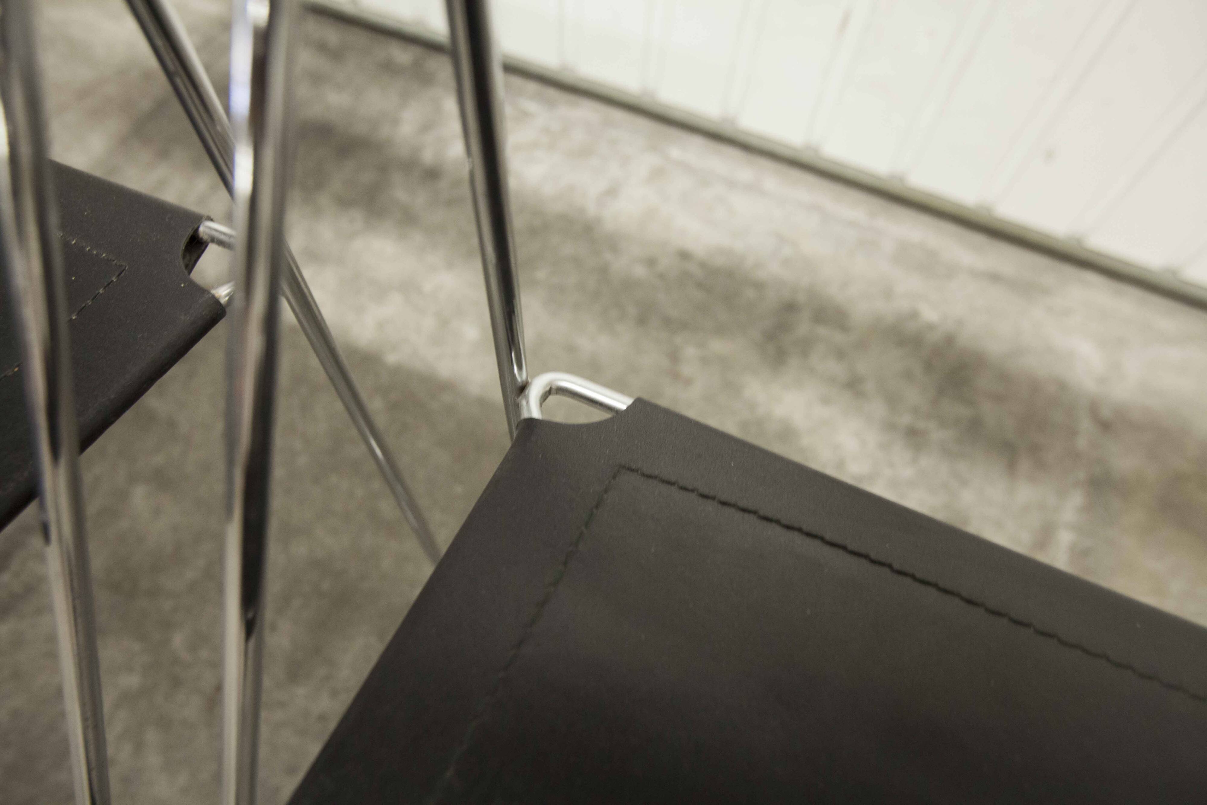 Set of 3 minimalist X line chairs by Niels Jorgen Haugesen.