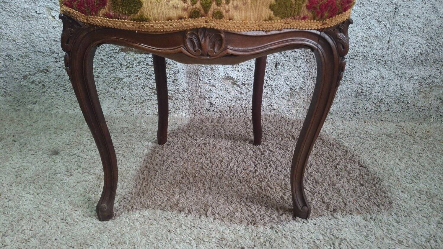 Carved walnut Napoleon III style velvet medallion chair