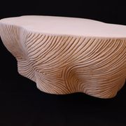 Spiral, designer coffee table with stone effect, unique handmade creation.