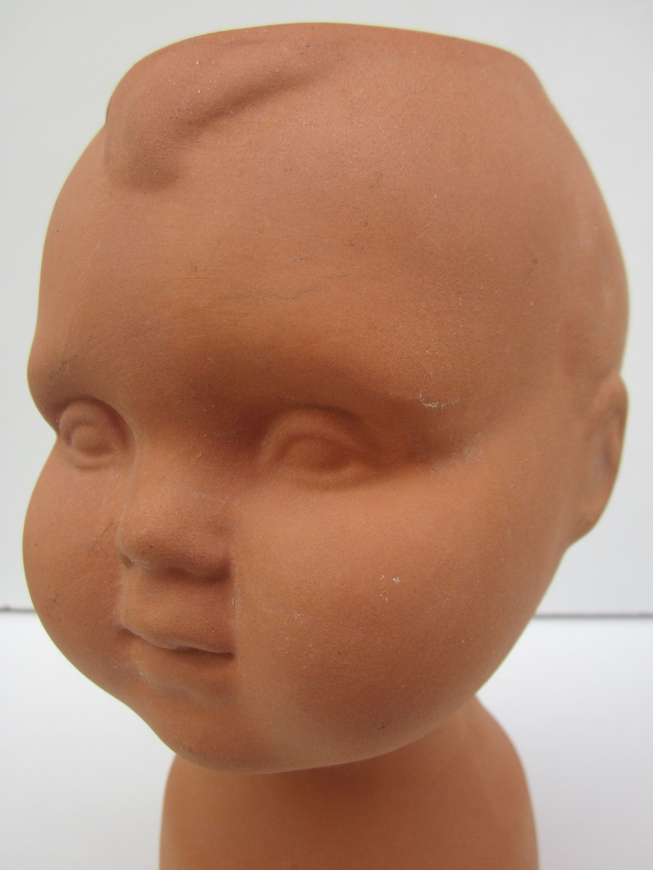 Terracotta vase: child's head