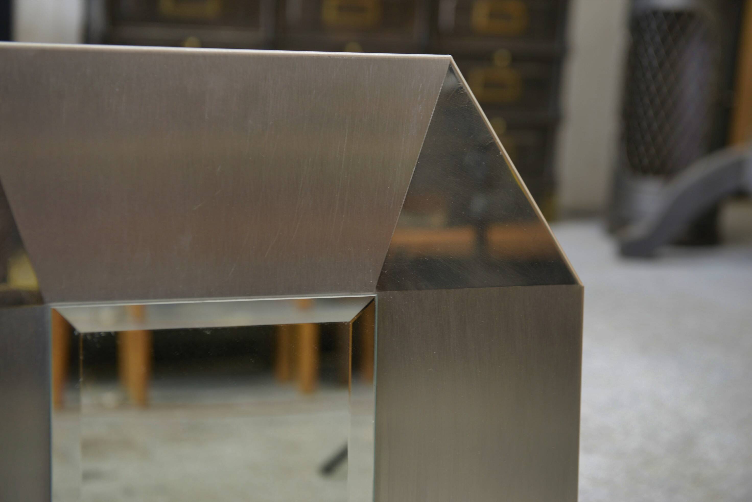 Designer mirror in brushed and chrome-plated stainless steel, beveled glass, 1970s