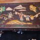 Chinese black lacquer coffee table with figurative decoration – Coromandel style – 20th century.