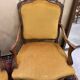 Pair of faux Louis XV armchairs in fully carved walnut
